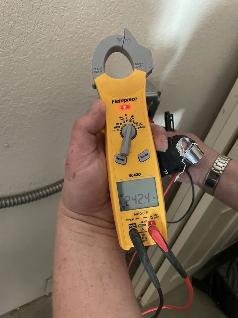 Voltage testing with clamp meter during Ceiling Fan Installation in Catoosa